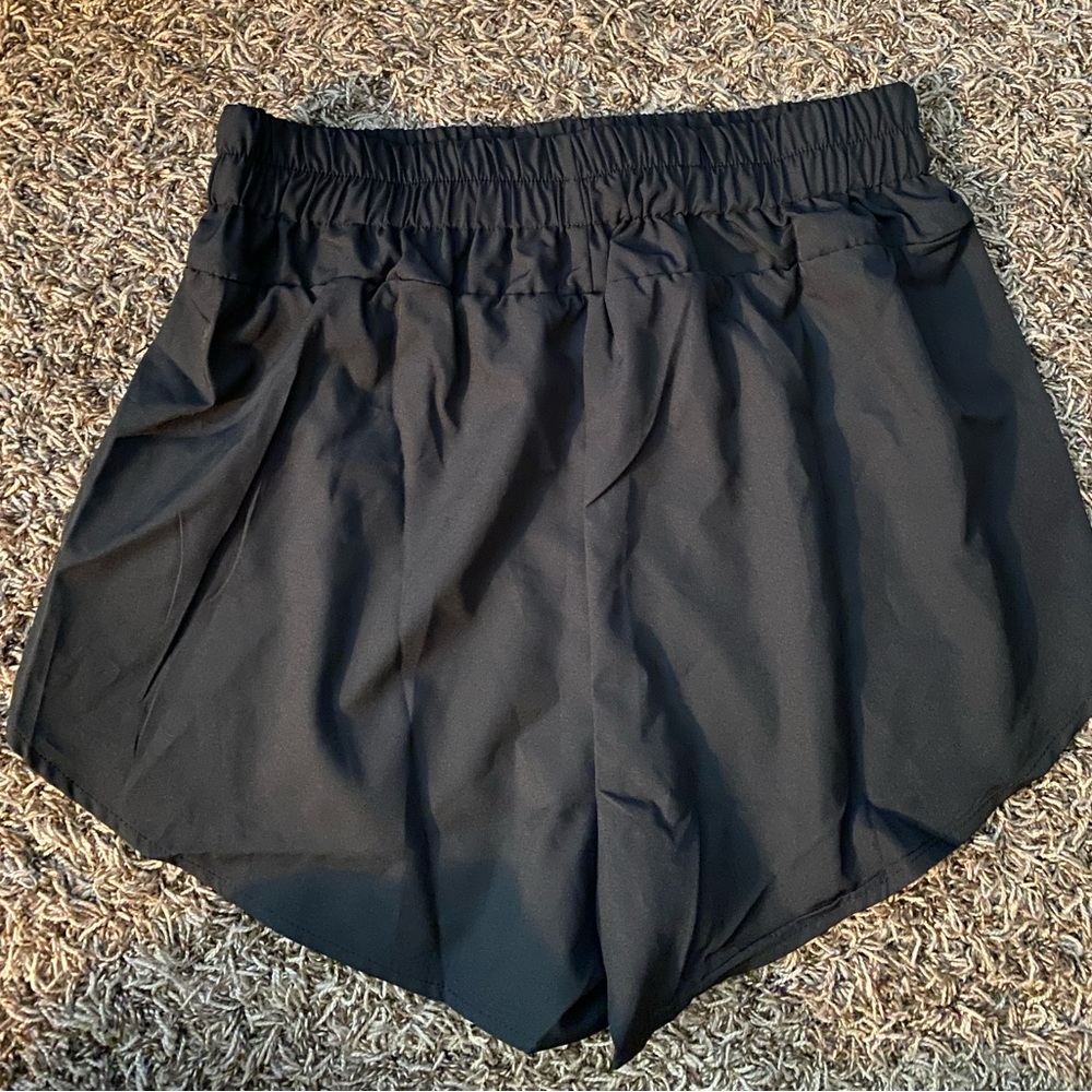 Black casual lounge shorts. Waist is elastic and is scrunched (see pictu…